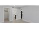 Bright bedroom with doorways to the bathroom and walk-in closet at 19505 Quesada Ave # Ss102, Port Charlotte, FL 33948