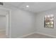 Bedroom with a closet and a window overlooking the outdoors at 19505 Quesada Ave # Ss102, Port Charlotte, FL 33948