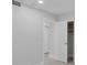 Bright bedroom featuring neutral walls, tiled floors, and a closet with open door at 19505 Quesada Ave # Ss102, Port Charlotte, FL 33948