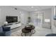 Stylishly furnished living room with comfortable seating and a bright, airy atmosphere at 19505 Quesada Ave # Ss102, Port Charlotte, FL 33948