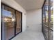 Enclosed patio with black sliding glass doors, a light, textured wall, and tile floor at 19505 Quesada Ave # Ss102, Port Charlotte, FL 33948