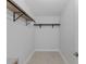 Spacious walk-in closet with custom shelves and ample storage space at 19505 Quesada Ave # Ss102, Port Charlotte, FL 33948