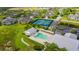 An aerial view of community pool, tennis courts, and residences at 2040 Willow Hammock Cir # 208, Punta Gorda, FL 33983