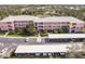 Aerial view of a residential complex, highlighting parking, landscaping, and architectural design at 2040 Willow Hammock Cir # 208, Punta Gorda, FL 33983