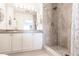 Bathroom with a gray tiled shower, modern fixtures, and a spacious vanity at 2040 Willow Hammock Cir # 208, Punta Gorda, FL 33983