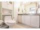 Bathroom featuring a toilet, vanity with storage, and a large mirror at 2040 Willow Hammock Cir # 208, Punta Gorda, FL 33983