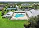 Aerial shot of the community pool and surrounding sun loungers and green space at 2040 Willow Hammock Cir # 208, Punta Gorda, FL 33983