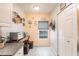 Cozy eat-in kitchen area with natural light, storage closet, and views of the front yard at 2040 Willow Hammock Cir # 208, Punta Gorda, FL 33983