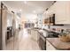 Open-concept kitchen with stainless appliances and seamless flow into dining and living areas at 2040 Willow Hammock Cir # 208, Punta Gorda, FL 33983
