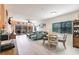 Bright living room with modern furniture, light wood flooring, and sliding doors to the lanai at 2040 Willow Hammock Cir # 208, Punta Gorda, FL 33983