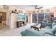 Open-concept living room with neutral decor, a ceiling fan, and sliding glass doors to an outdoor area at 2040 Willow Hammock Cir # 208, Punta Gorda, FL 33983