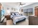 Comfortable bedroom featuring a ceiling fan, natural light, and calming blue color scheme at 2040 Willow Hammock Cir # 208, Punta Gorda, FL 33983