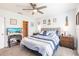 Spacious bedroom with a ceiling fan, two nightstands, and a TV at 2040 Willow Hammock Cir # 208, Punta Gorda, FL 33983