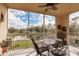 Charming screened patio with views of lush greenery and a peaceful pond creating a serene outdoor living space at 2040 Willow Hammock Cir # 208, Punta Gorda, FL 33983