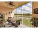 Relaxing screened patio with views of lush greenery and a serene pond, perfect for outdoor enjoyment at 2040 Willow Hammock Cir # 208, Punta Gorda, FL 33983