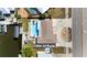 Home's layout is showcased in an aerial view including a pool, lanai, driveway, and boat dock at 21184 Edgewater Dr, Port Charlotte, FL 33952