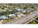 Aerial view of home showing it in relationship to other homes, streets, and canals at 21184 Edgewater Dr, Port Charlotte, FL 33952