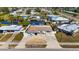 Aerial view of house showing landscaping, driveway, and neighborhood at 21184 Edgewater Dr, Port Charlotte, FL 33952