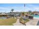 A sunny outdoor space featuring a boat dock and a waterside pool at 21184 Edgewater Dr, Port Charlotte, FL 33952