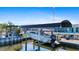 Waterfront home featuring a covered boat lift with easy access to open water at 21184 Edgewater Dr, Port Charlotte, FL 33952
