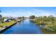 Waterfront property boasts direct canal access for boating and picturesque water views at 21184 Edgewater Dr, Port Charlotte, FL 33952