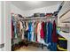 Walk-in closet with ample hanging space and storage shelves for shoes and folded clothing at 21184 Edgewater Dr, Port Charlotte, FL 33952