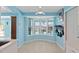Bright dining area with large bay windows overlooking the pool and outdoor space at 21184 Edgewater Dr, Port Charlotte, FL 33952