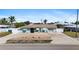 Charming single-story home featuring a well-manicured lawn and inviting curb appeal at 21184 Edgewater Dr, Port Charlotte, FL 33952