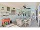Comfortable screened patio with dining set, ideal for outdoor gatherings and poolside relaxation at 21184 Edgewater Dr, Port Charlotte, FL 33952