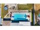 Aerial of the sparkling pool with lounge chairs in a private backyard at 21184 Edgewater Dr, Port Charlotte, FL 33952