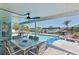 Inviting outdoor pool and patio area with waterfront views, perfect for relaxation and entertaining at 21184 Edgewater Dr, Port Charlotte, FL 33952