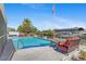 Beautiful backyard pool with patio and boat dock, creating a perfect waterfront oasis for leisure at 21184 Edgewater Dr, Port Charlotte, FL 33952