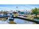 Enjoy waterfront living with a private boat dock, pool, and outdoor entertaining area at 21184 Edgewater Dr, Port Charlotte, FL 33952