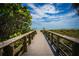Charming wooden boardwalk offering direct access to the beach with stunning views at 21422 Mallory Ave, Port Charlotte, FL 33952