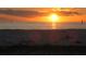 Serene beach at sunset, casting warm colors across the sky and reflecting on the water at 21422 Mallory Ave, Port Charlotte, FL 33952