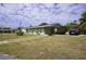 Charming single-story home featuring a well-maintained front yard and private parking at 21422 Mallory Ave, Port Charlotte, FL 33952