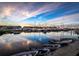 Stunning marina view featuring yachts, boats, and serene water with a beautiful sunset sky at 21422 Mallory Ave, Port Charlotte, FL 33952