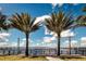 Picturesque waterfront view showcasing palm trees, a bridge, and tranquil waters at 21422 Mallory Ave, Port Charlotte, FL 33952