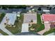 Waterfront property showcases expansive lawn, boat dock, and prime canal access, set in a friendly community at 240 Riviera Ct, Punta Gorda, FL 33950