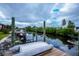 Scenic backyard canal view from the wooden dock at 240 Riviera Ct, Punta Gorda, FL 33950