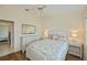 Cozy bedroom with a full bed, dresser, and soft lighting for a relaxing ambiance at 240 Riviera Ct, Punta Gorda, FL 33950