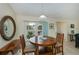 Cozy dining area with a wooden table, comfortable seating, and bright natural light at 240 Riviera Ct, Punta Gorda, FL 33950