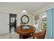 Cozy dining area with a wooden table, comfortable seating, and bright natural light at 240 Riviera Ct, Punta Gorda, FL 33950