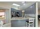 Modern kitchen features sleek gray cabinets, stainless steel appliances, and a bright skylight at 240 Riviera Ct, Punta Gorda, FL 33950