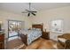 Comfortable main bedroom with plenty of natural light and access to an outdoor deck at 240 Riviera Ct, Punta Gorda, FL 33950
