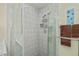 A large glass shower features updated tile, a built-in bench, and modern shower fixtures at 240 Riviera Ct, Punta Gorda, FL 33950