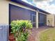 Backyard with a screened lanai and manicured landscaping at 2419 Daisy Dr, North Port, FL 34289