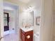 Well-lit bathroom featuring neutral colors and shower at 2419 Daisy Dr, North Port, FL 34289
