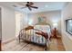 Cozy bedroom with a decorative metal bed frame and a patterned rug at 2419 Daisy Dr, North Port, FL 34289