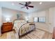 Comfortable bedroom featuring a patterned metal bed frame and side tables at 2419 Daisy Dr, North Port, FL 34289